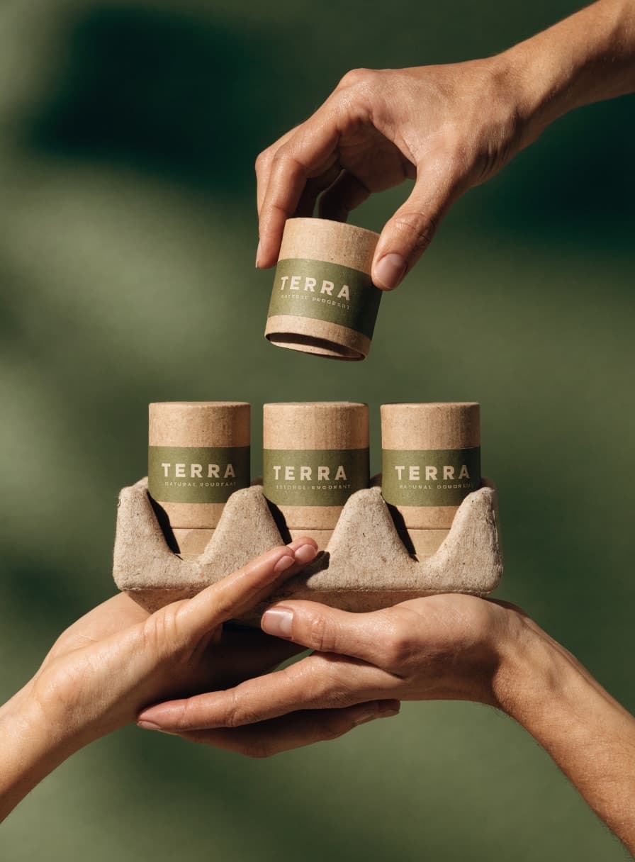 Products offered on a moulded pulp tray by two hands